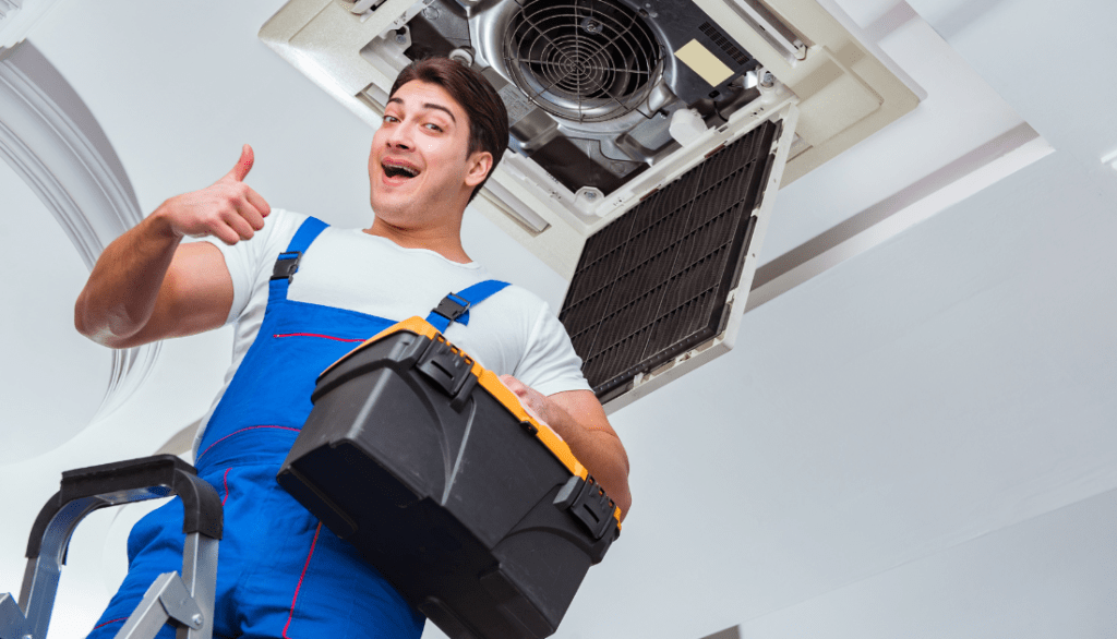 Worker repairing Ceiling Air Conditioning Unit